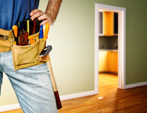 A homeowner with a tool belt ready for preventative home maintenance