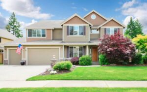 A large home with three-stall garage is safe now but could sustain damage from one of the top four spring insurance hazards.